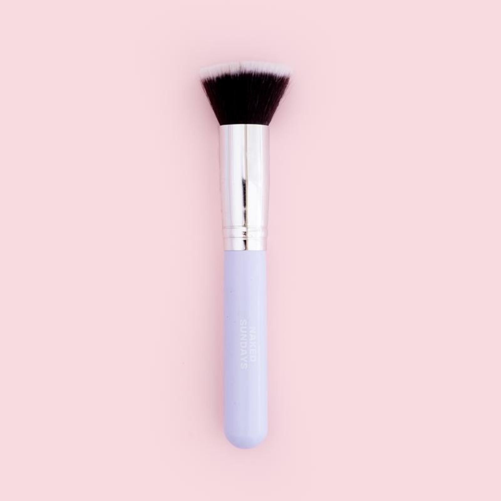 SPF Makeup Brush on Pink background
