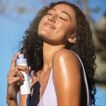 Glow Body Mist Sunscreen Spray with model